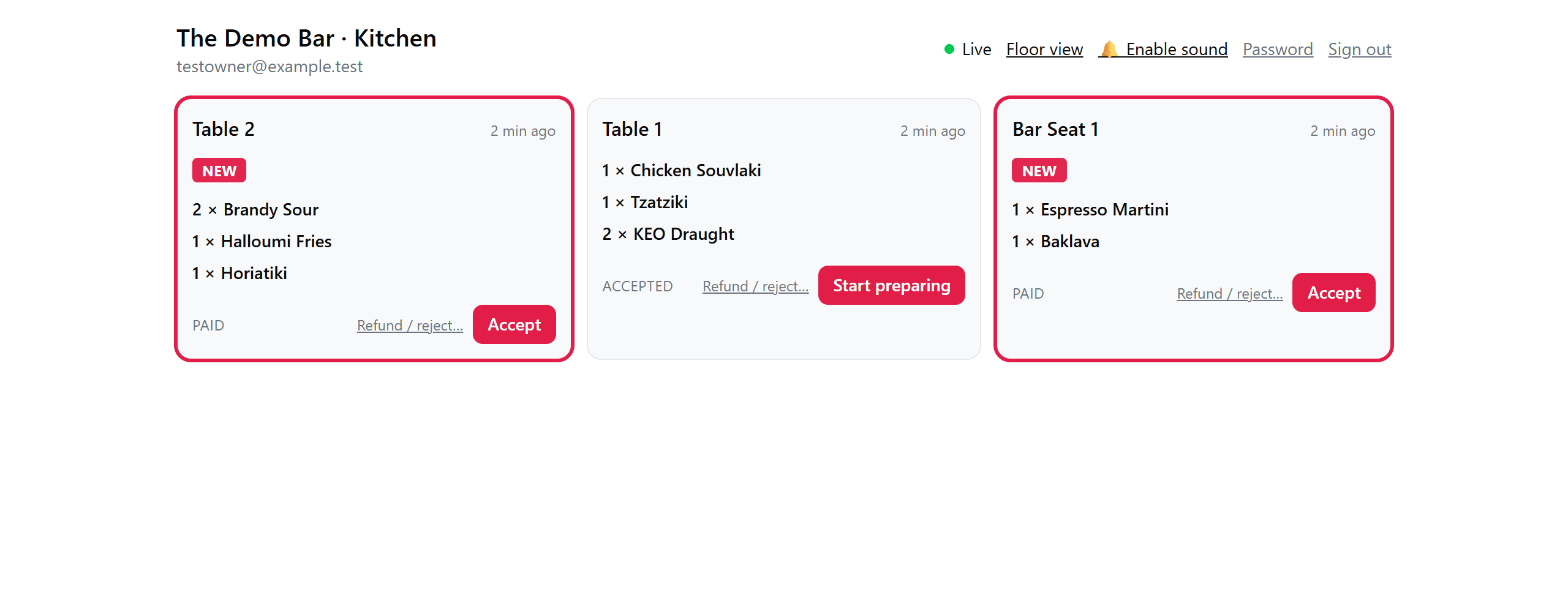 The staff kitchen board: live orders as cards with items, table numbers and status buttons